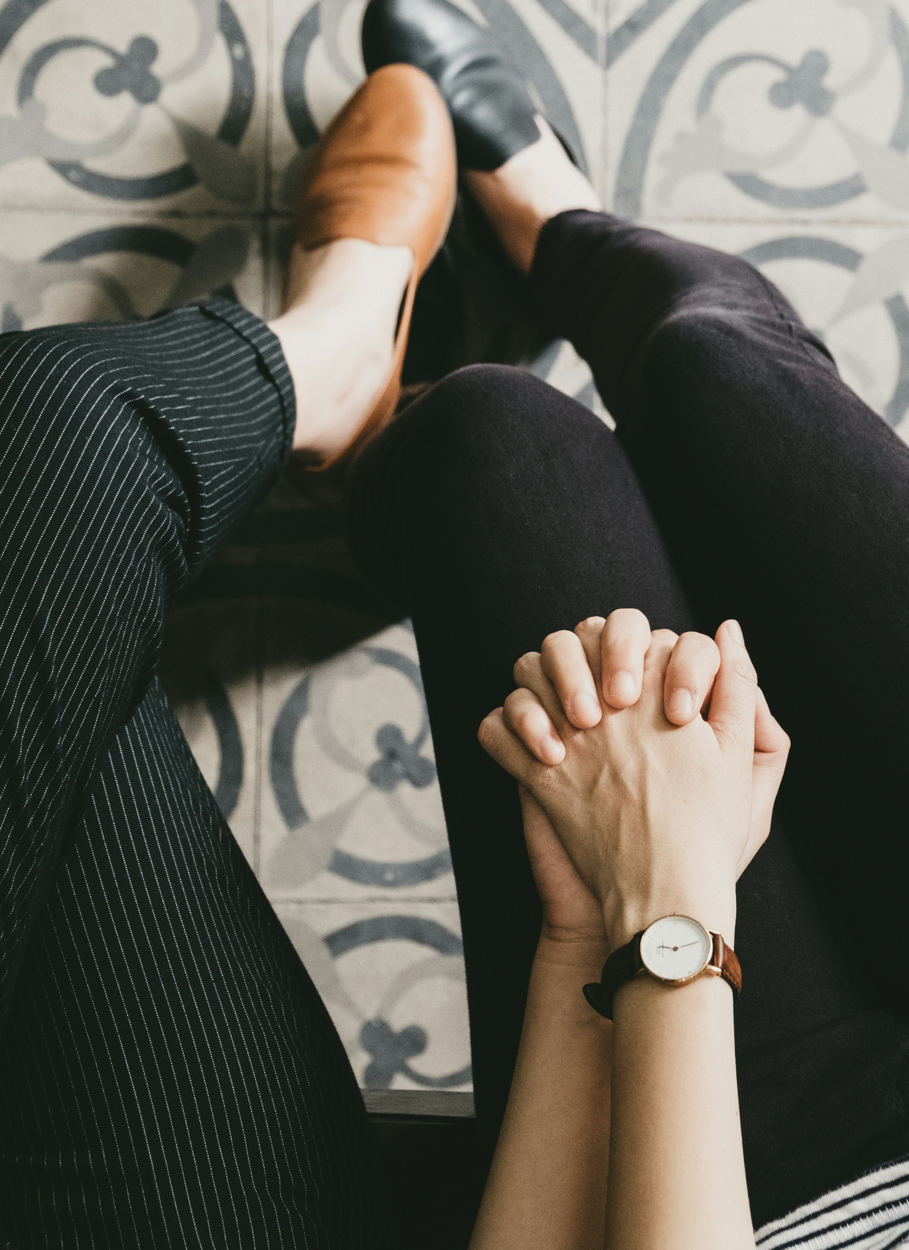 Two people clasping hands